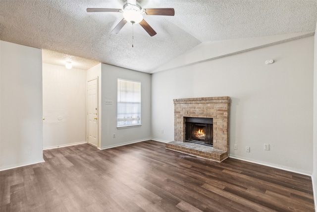 unfurnished living room with a fireplace, dark hardwood / wood-style flooring, and vaulted ceiling