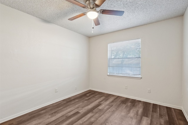 spare room featuring a textured ceiling, ceiling fan, and dark hardwood / wood-style floors