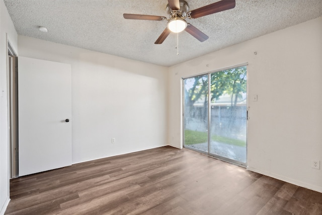 spare room with hardwood / wood-style flooring, ceiling fan, and a textured ceiling