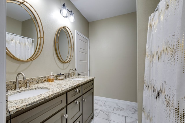 206 Willowbrook Ave, Tyler, TX 75702 - bathroom featuring marble finish floors, double vanity, baseboards, and a shower with curtain