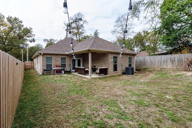 206 Willowbrook Ave, Tyler, TX 75702 - rear view of property with an outdoor living space, brick siding, central AC, and a patio