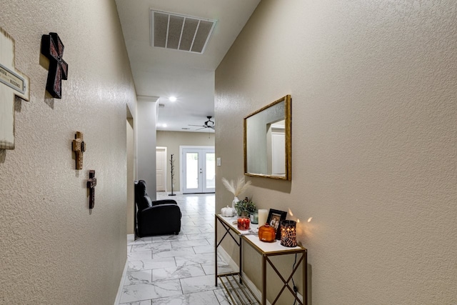 206 Willowbrook Ave, Tyler, TX 75702 - hall with light marble finish flooring and a textured wall