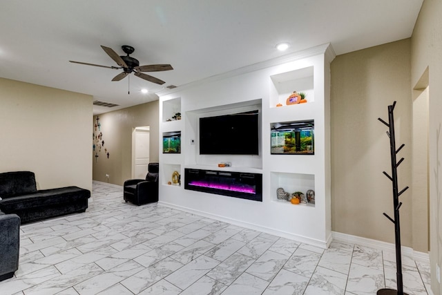 living room with built in shelves, ceiling fan, and ornamental molding