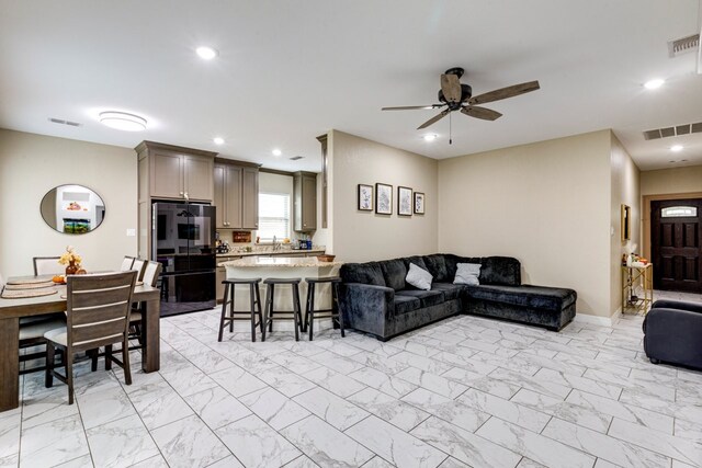 206 Willowbrook Ave, Tyler, TX 75702 - living room featuring light marble finish flooring, ceiling fan, recessed lighting, and baseboards