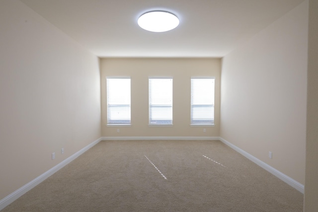 unfurnished room with carpet floors