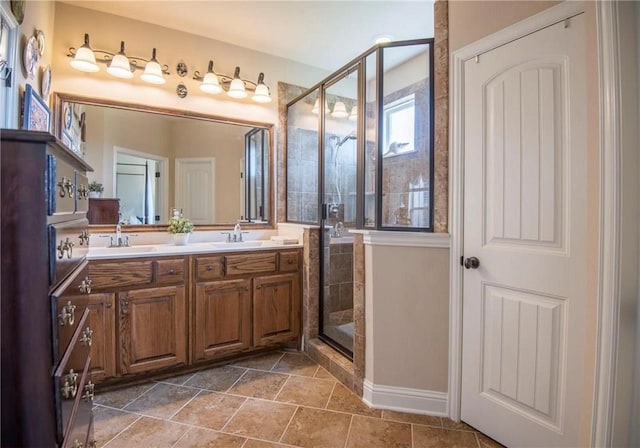 bathroom with vanity, tile patterned floors, and walk in shower