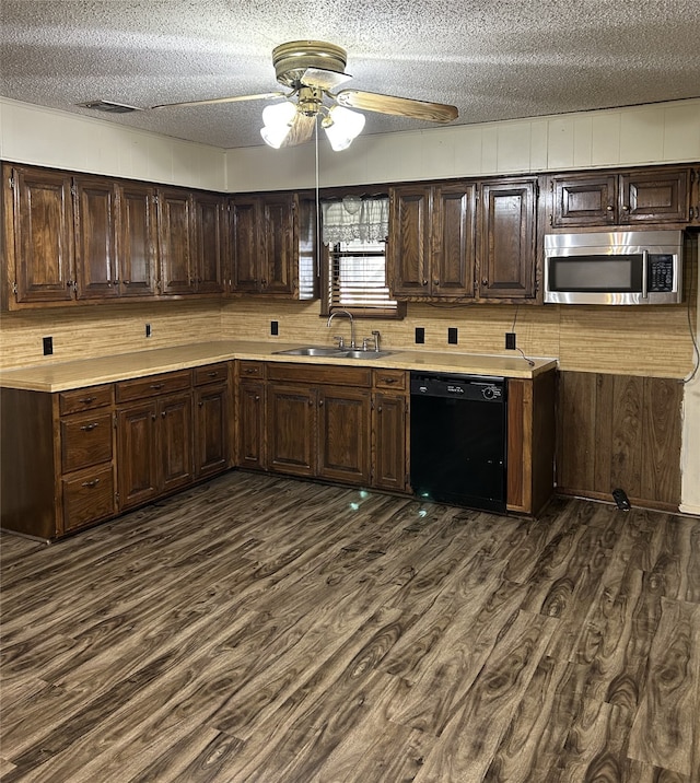 kitchen with dishwasher, sink, dark hardwood / wood-style floors, ceiling fan, and a textured ceiling