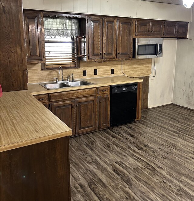 kitchen featuring decorative backsplash, dark brown cabinets, dark wood-type flooring, sink, and dishwasher