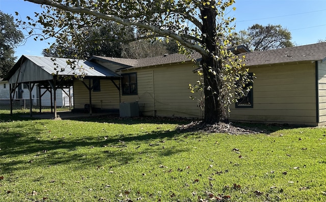 view of property exterior featuring a gazebo, a yard, and central AC unit