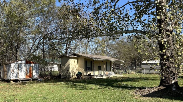 exterior space featuring a shed