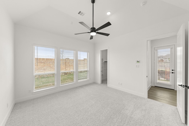 3100 Summer Rain Ln, Anna, TX 75409 - unfurnished bedroom featuring multiple windows, carpet flooring, a ceiling fan, and a walk in closet