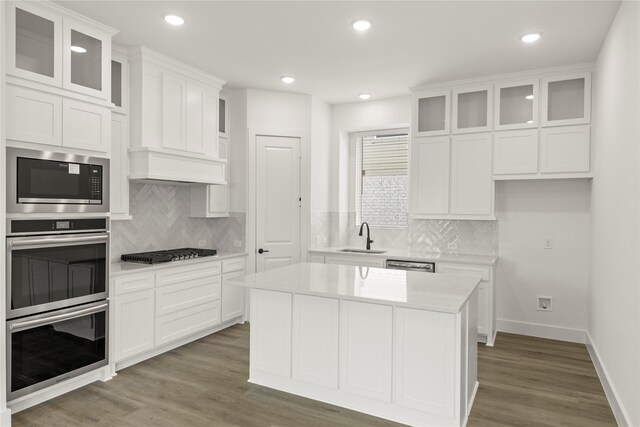 3100 Summer Rain Ln, Anna, TX 75409 - kitchen featuring stainless steel appliances, backsplash, wood finished floors, light countertops, and recessed lighting