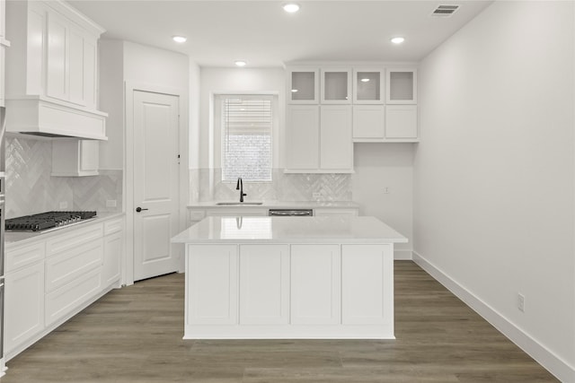 3100 Summer Rain Ln, Anna, TX 75409 - kitchen with stainless steel gas stovetop, white cabinets, light countertops, decorative backsplash, and recessed lighting