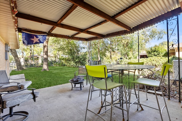 view of patio / terrace with an outdoor fire pit