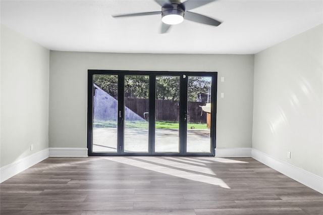 unfurnished room with french doors, ceiling fan, and hardwood / wood-style floors