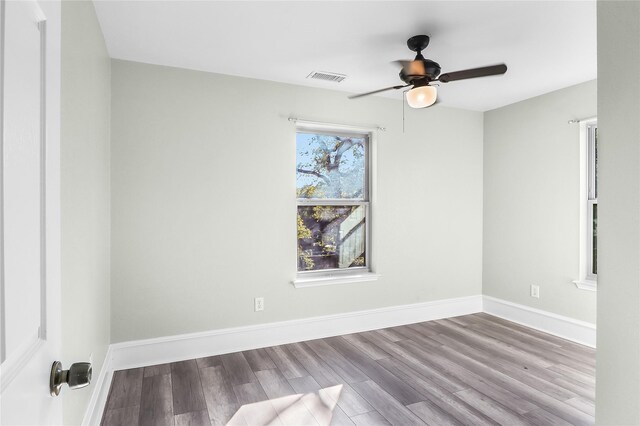 empty room featuring light hardwood / wood-style flooring and ceiling fan