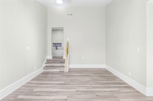 staircase featuring hardwood / wood-style flooring