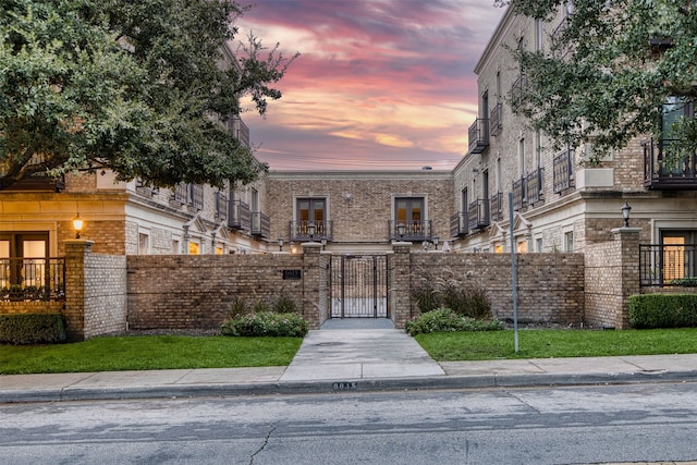 view of outdoor building at dusk