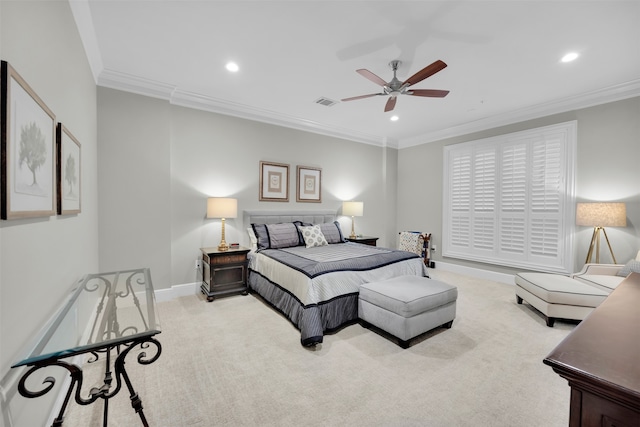 carpeted bedroom with ceiling fan and ornamental molding