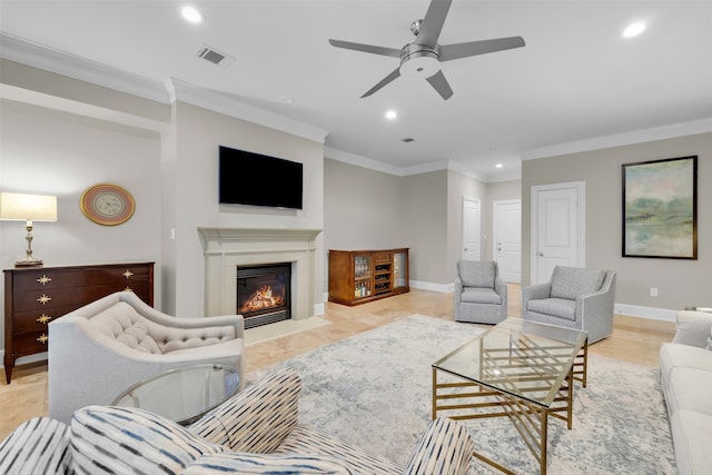 living room featuring ceiling fan and ornamental molding