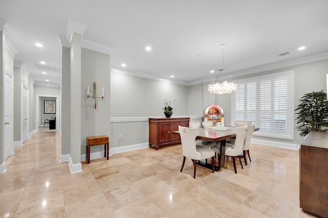 dining space with ornamental molding and an inviting chandelier