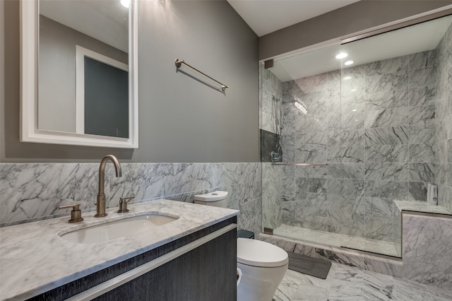 bathroom with tiled shower, toilet, tile walls, and vanity