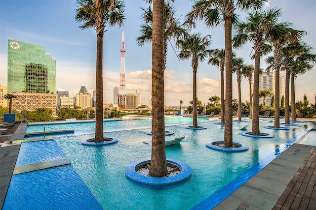 view of pool at dusk