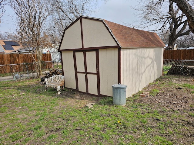 view of outbuilding with a yard