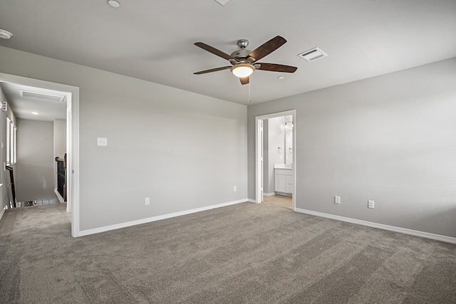 spare room featuring ceiling fan and carpet