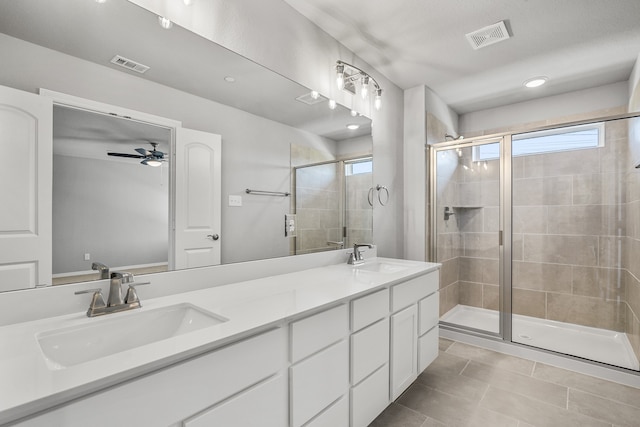 bathroom featuring vanity, tile patterned floors, an enclosed shower, and ceiling fan