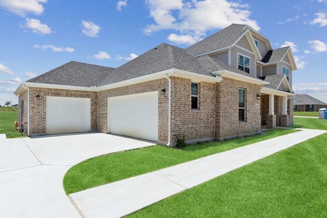 view of front facade with a front yard and a garage