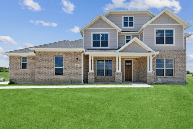 craftsman house with a front lawn