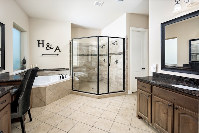 bathroom featuring vanity, tile patterned floors, and separate shower and tub