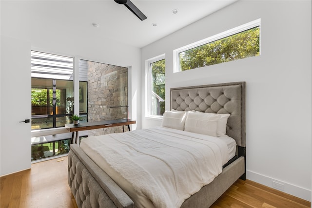 bedroom featuring ceiling fan and light wood-type flooring