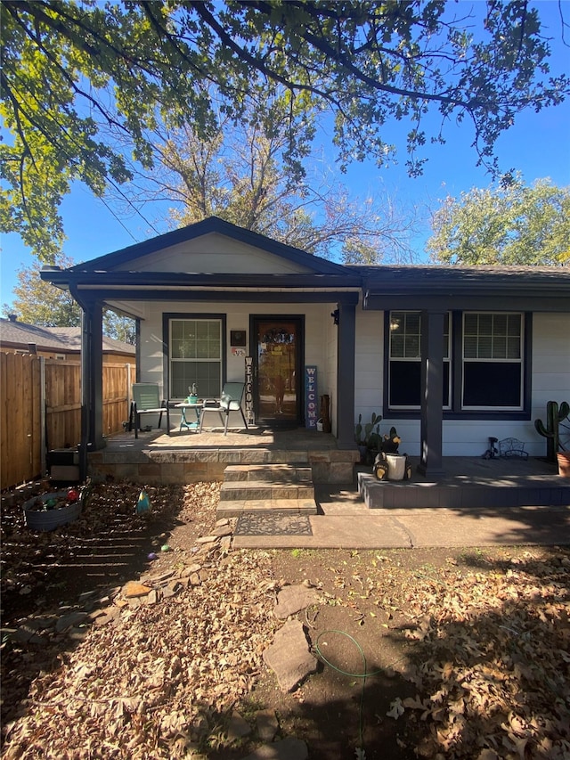 ranch-style house featuring a porch