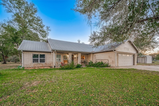 ranch-style home with a garage and a front yard