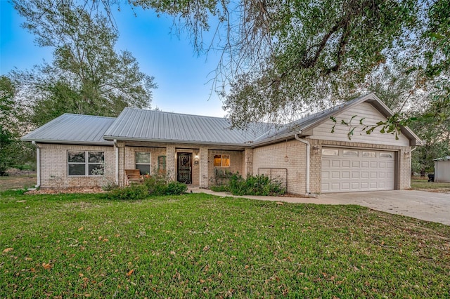 ranch-style home featuring a front yard and a garage