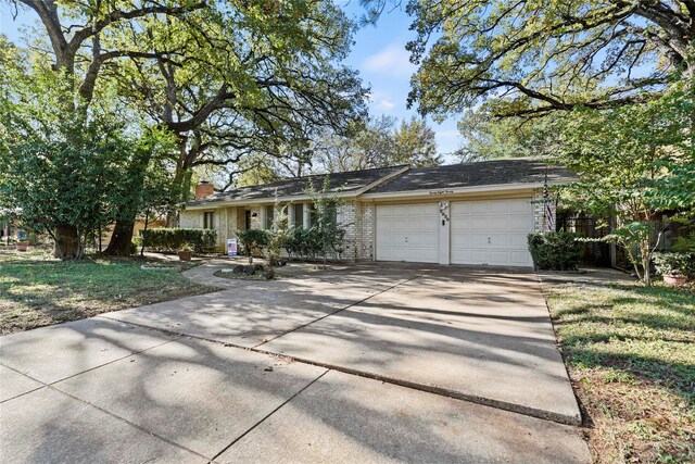 ranch-style house featuring a garage