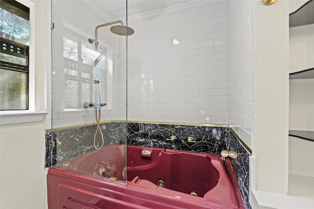 bathroom with ornamental molding and tiled shower / bath combo