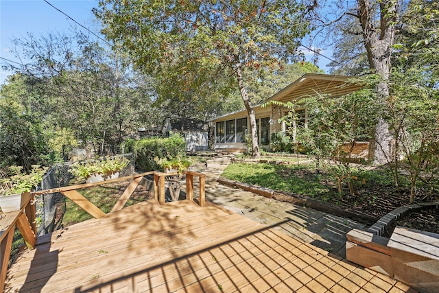 wooden terrace with a sunroom