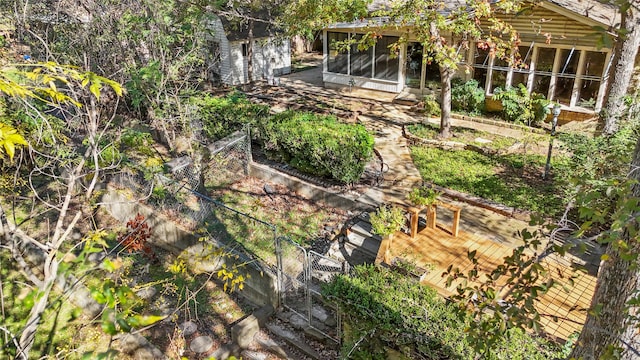 view of yard with a wooden deck and a sunroom