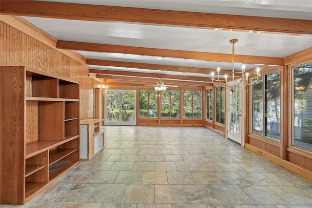 unfurnished sunroom with plenty of natural light, beam ceiling, and a notable chandelier