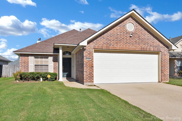 view of front of home featuring a garage and a front lawn