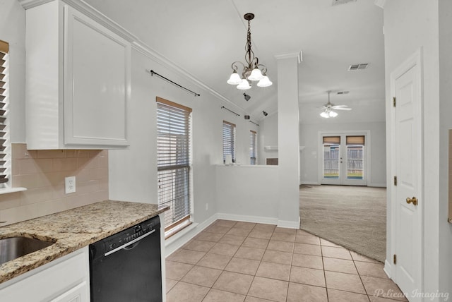 kitchen featuring white cabinetry, dishwasher, a healthy amount of sunlight, and light carpet