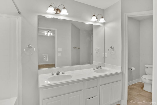 bathroom featuring tile patterned floors, vanity, and toilet