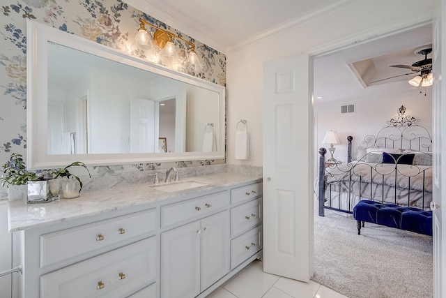 bathroom featuring crown molding, tile patterned flooring, vanity, and ceiling fan