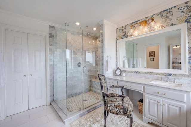 bathroom featuring tile patterned floors, vanity, walk in shower, and ornamental molding