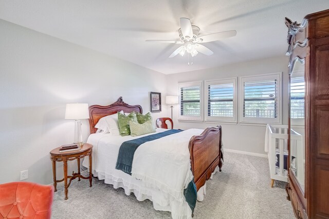 carpeted bedroom featuring ceiling fan