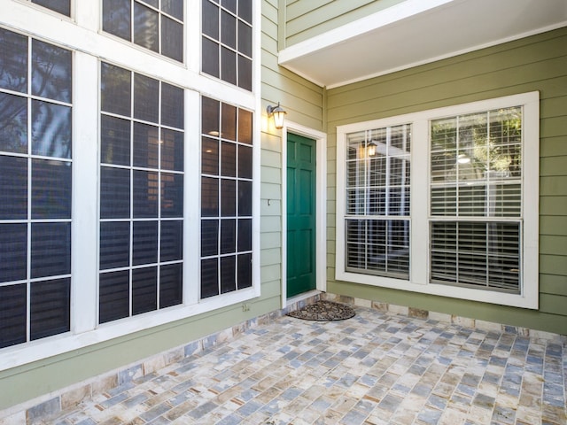 doorway to property with a patio area