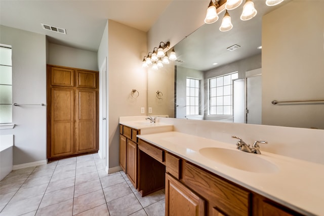 bathroom featuring tile patterned flooring, vanity, and shower with separate bathtub